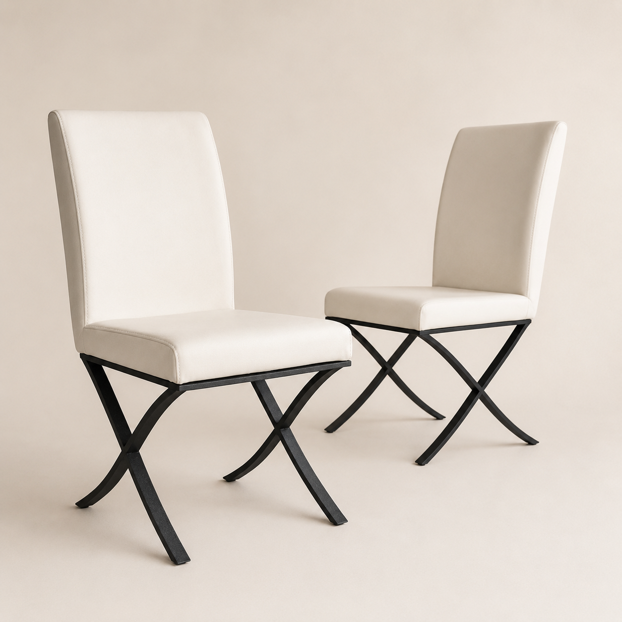 Padded cream faux leather dining chairs on black cross legs – clearance set
